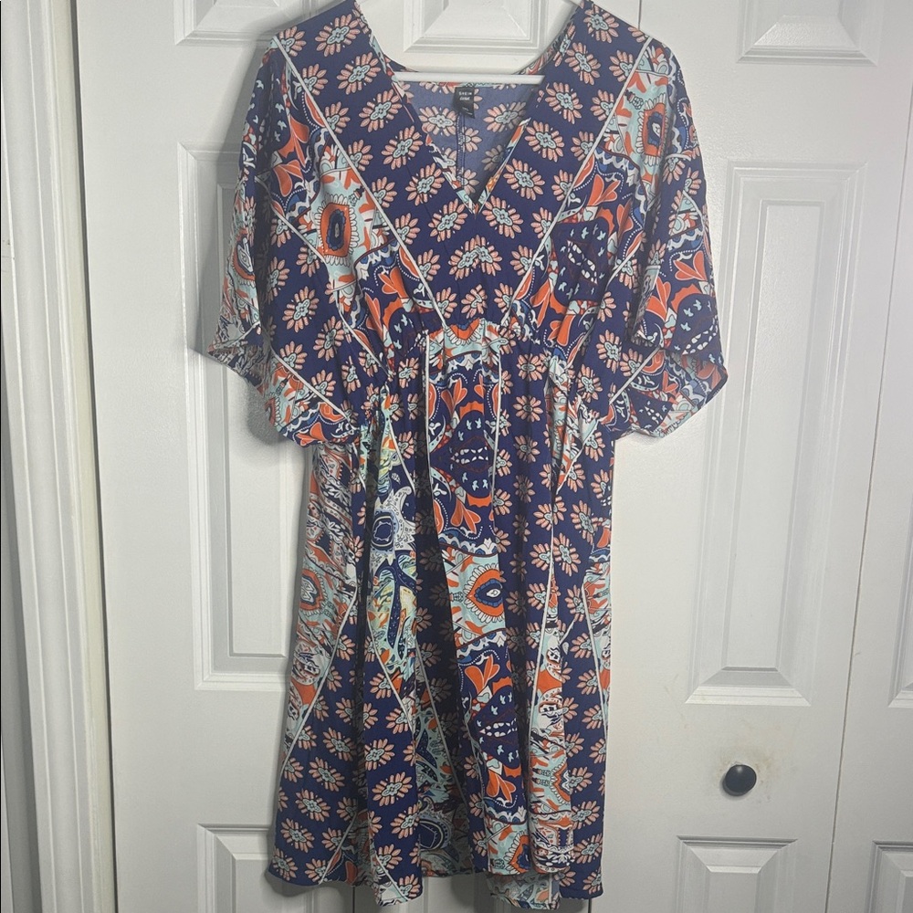 SHEIN CURVE blue and orange floral print bohemian-style v-neck mini dress.